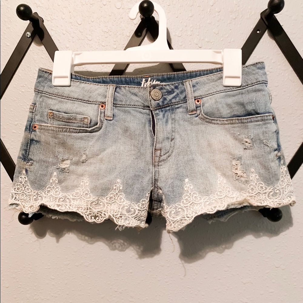 Denim shorts with lace detail size 4